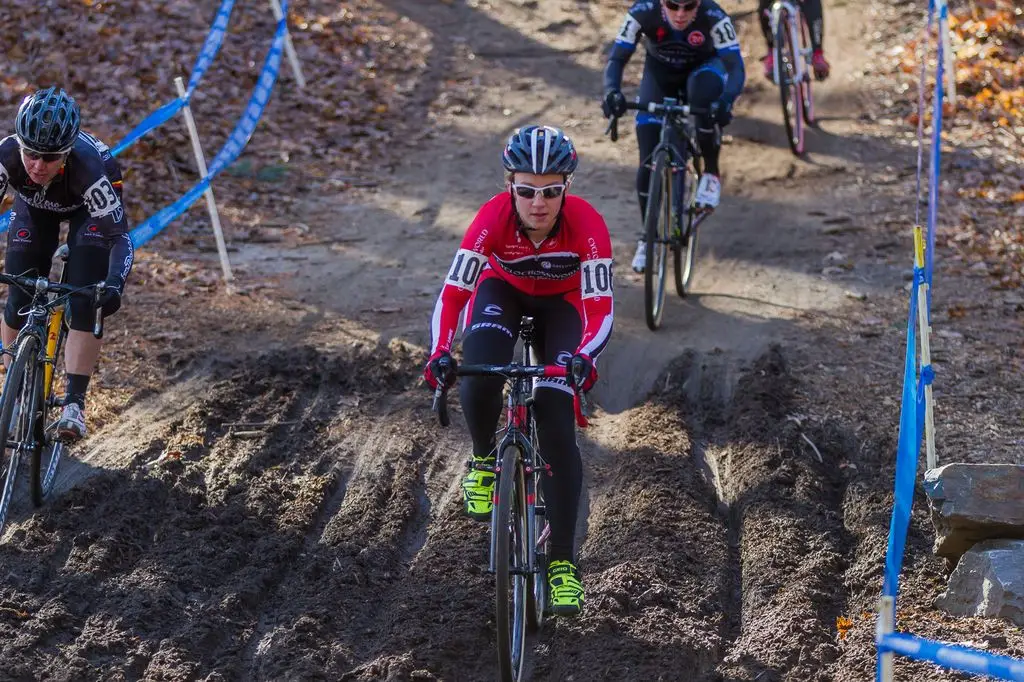 Emma White (Cyclocrossworld.com), center, and Laura Van Gilder (Van Dessel p/b Mellow Mushroom) take different lines through the mud. © Todd Prekaski