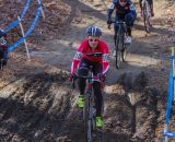 Emma White (Cyclocrossworld.com), center, and Laura Van Gilder (Van Dessel p/b Mellow Mushroom) take different lines through the mud. © Todd Prekaski