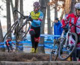 Adam Myerson (Team SmartStop p/b Mountain Khakis), center, negotiating the logs. © Todd Prekaski