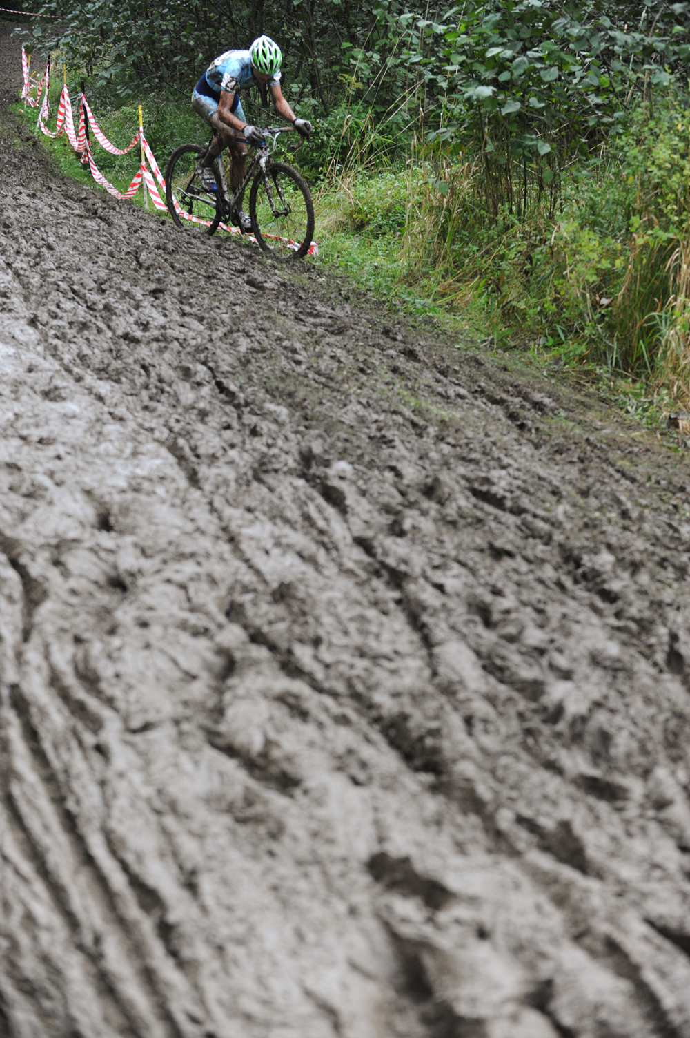 A racer fights through the muck. ©  Jeff Bramhall