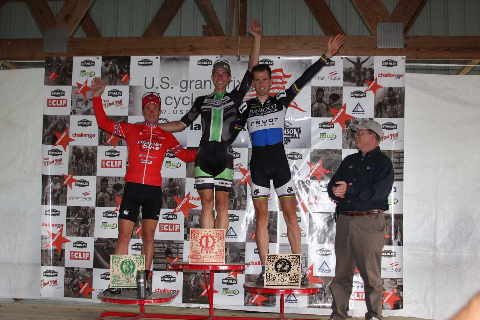 The Mens Podium, with Page (3rd), Powers (1st) and Vervecken (3rd). ? Amy Dykema