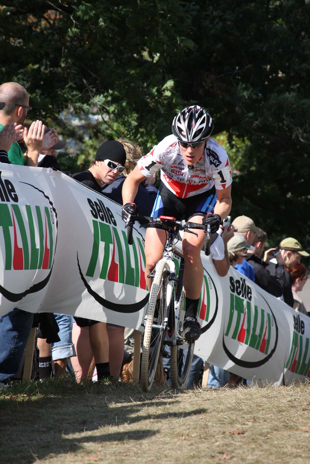 Katie Compton quickly put the field behind her, powering away on the day\'s stiff climb. by Amy Dykema