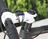 Jacobs’ white Easton EA90 stem stands out against the black bike, and has a standard Garmin mount atop. The stem holds Easton’s EA70 bar as well. Note the rear derailleur cable, with in-line barrel adjuster, running through the top tube. © Cyclocross Magazine