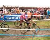 From right, Gabby Durrin (Rapha FOCUS), Meredith Miller (California Giant Strawberry/Specialized) and Nicole Duke (Marin/SPY) make their way past the packed crowd. Â© Kevin White