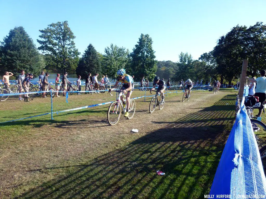 The men\'s pack was quickly strung out in the open grass.  © Cyclocross Magazine