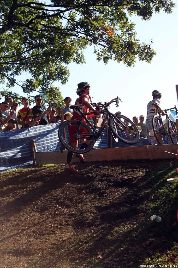 A rider just barely clears the barrier. © Cyclocross Magazine
