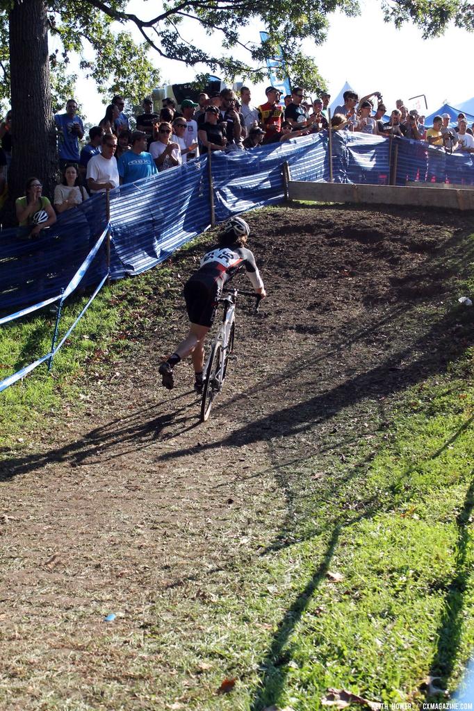A lone rider dismounts ahead of the barrier. © Cyclocross Magazine