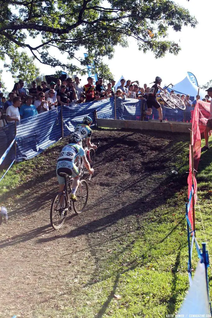 Two riders pursue a third through the barriers. © Cyclocross Magazine
