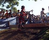 A rider just barely clears the barrier. © Cyclocross Magazine