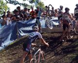 A rider has difficulty getting his bike over the barrier. © Cyclocross Magazine