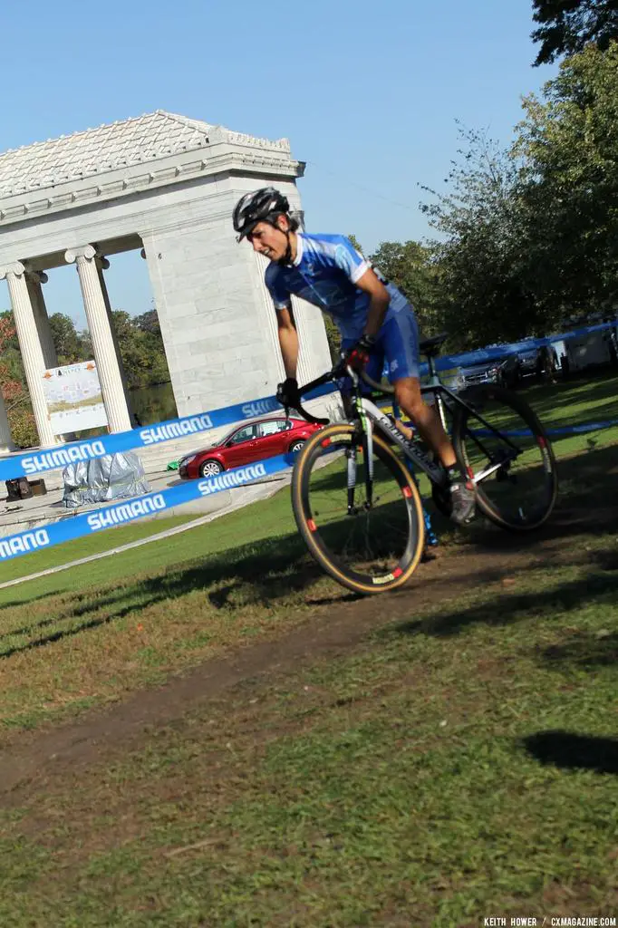 Another rider accelerates up and on to the grass. © Keith Hower