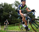 An Embrocation rider leans through the corner © Natalia Boltukhov | Pedal Power Photography