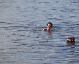 Post-race swim in Lake Sammamish after a muddy day at the races. © Joe Sales