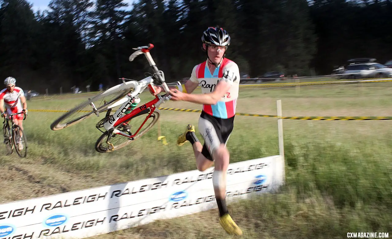 McDonald hits the barrier with speed. Raleigh Midsummer Night\'s cyclocross race. © Cyclocross Magazine