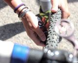 Mani checks her tire pressure pre-race at Raleigh Midsummer Nights Cross. © Cyclocross Magazine