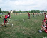 This Rutgers rider dives out of the way as the first cyclist heads for the barriers. © Molly Hurford 