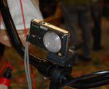 Want to shoot some POV video without buying a special camera? Then perhaps Electra Bicycles has a low cost solution. This handlebar mount fits most cameras. Just set to video mode, click record and hit the course. ? Dave Lawson