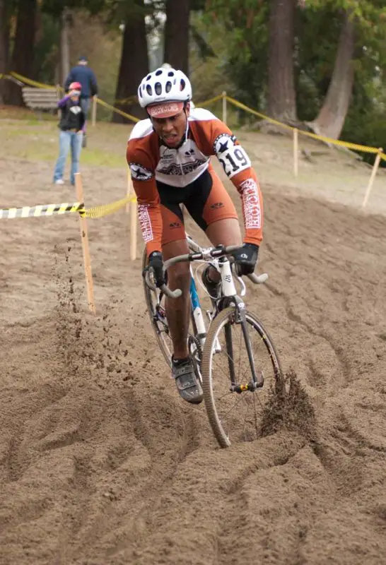 A Counterbalance Bicycles racer slips and slides through the sand © Karen Johanson