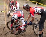 Two racers - Brian Wentz of Olympic Orthopaedic Associates and another - flip over the bars in short succession © Karen Johanson