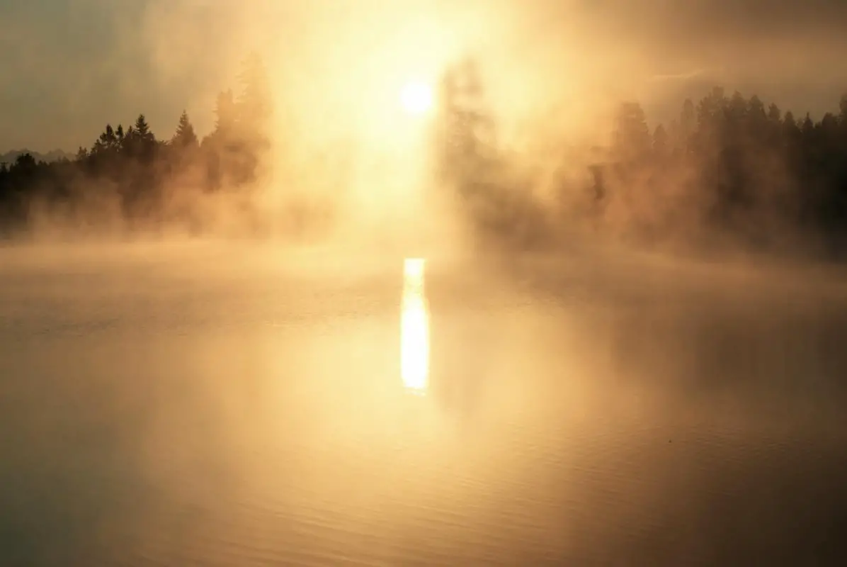 The morning sun and fog rise on Silver Lake © Kenton Berg