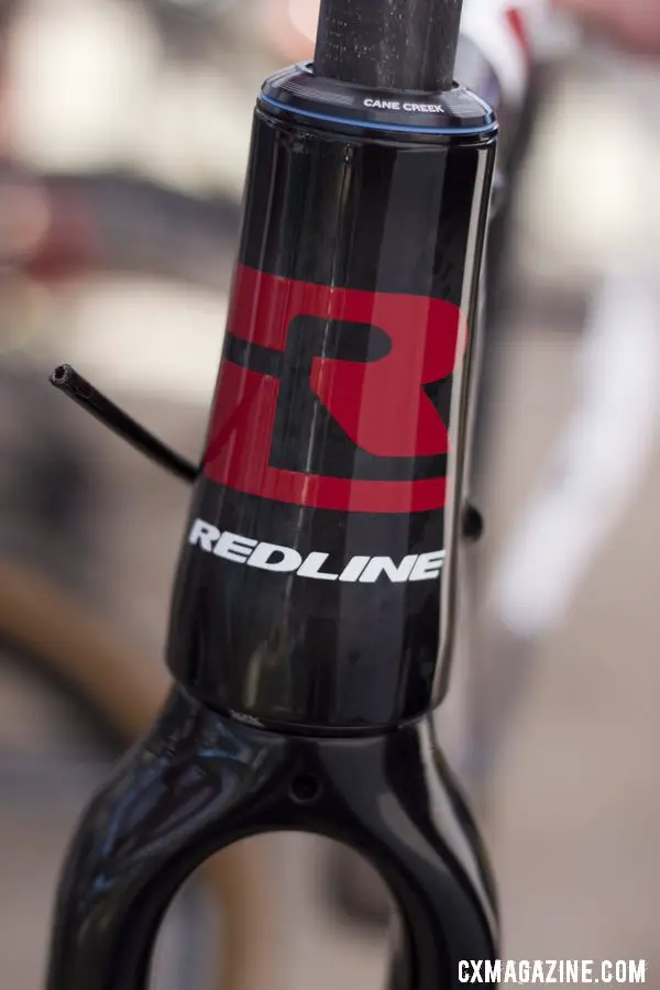 We got an exclusive preview of Redline 2013 products, but currently this bold head badge is all we\'re allowed to show you. Sea Otter 2012. ©Cyclocross Magazine