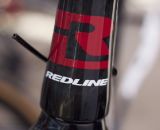 We got an exclusive preview of Redline 2013 products, but currently this bold head badge is all we're allowed to show you. Sea Otter 2012. ©Cyclocross Magazine