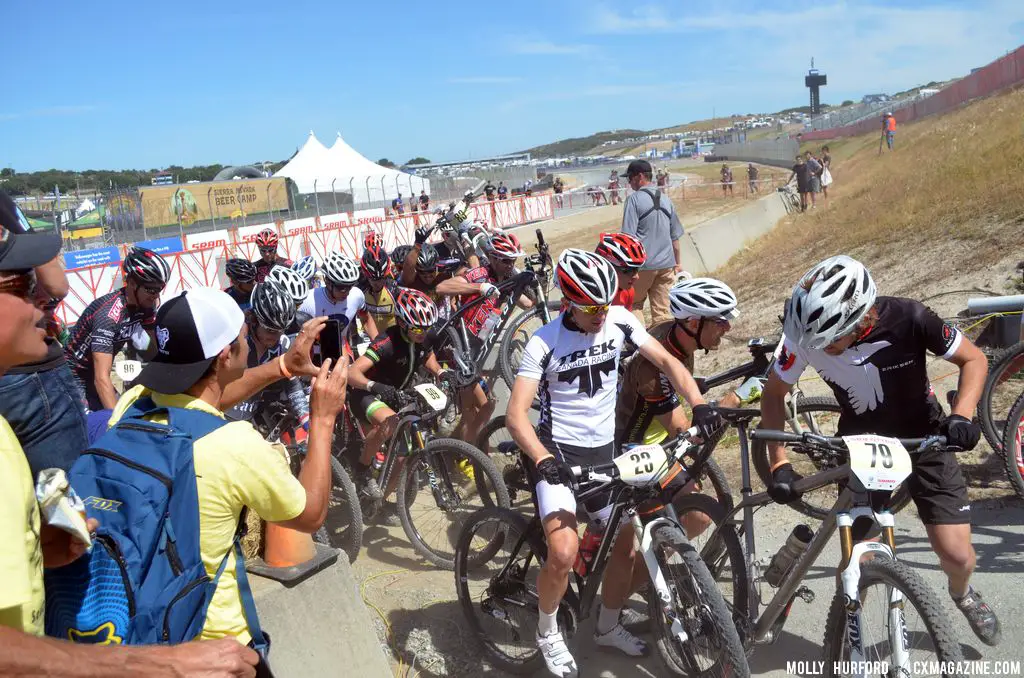 The men have a rough start as the path narrows at Sea Otter short track race 2013. © Cyclocross Magazine