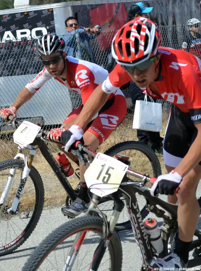 Lindine faces off with the Specialized racer at the Sea Otter short track race 2013. © Cyclocross Magazine