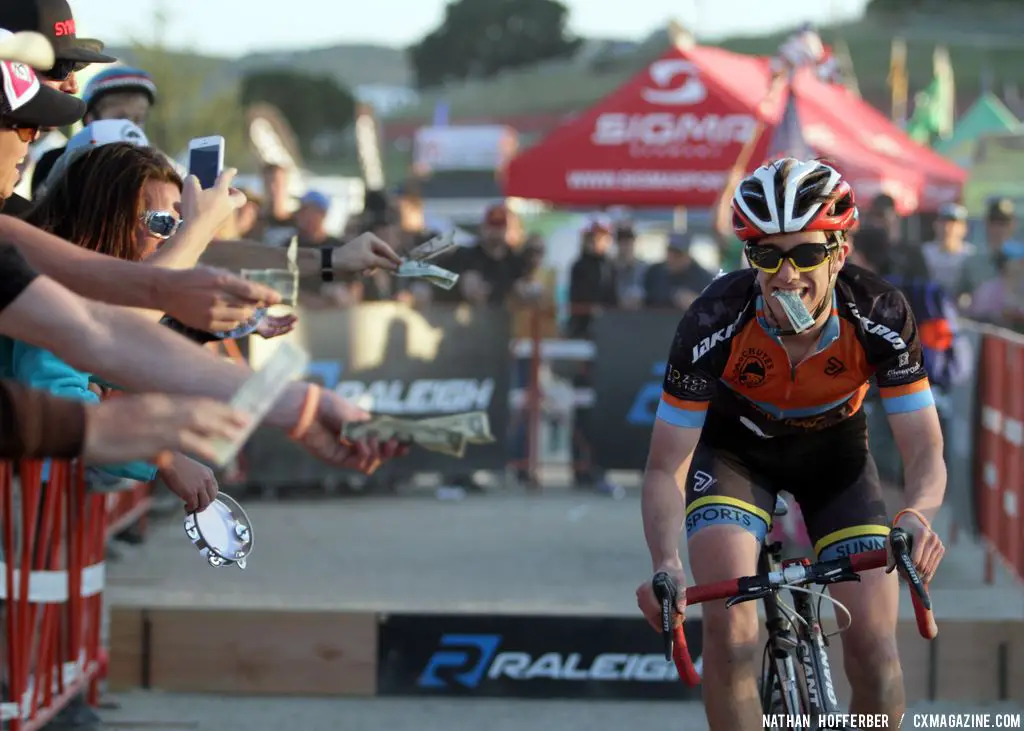 Paxson grabs dollar bills at the Raleigh cyclocross race at Sea Otter. © Cyclocross Magazine