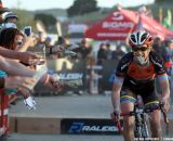 Paxson grabs dollar bills at the Raleigh cyclocross race at Sea Otter. © Cyclocross Magazine