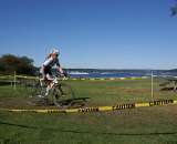 Women&#039;s racer readies for the barriers with Hydro&#039;s in background. by Kenton Berg