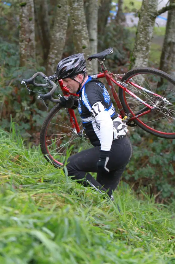 A rider is forced to shoulder his bike up one of the steeper sections © Janet Hill