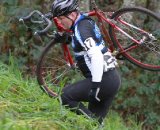 A rider is forced to shoulder his bike up one of the steeper sections © Janet Hill