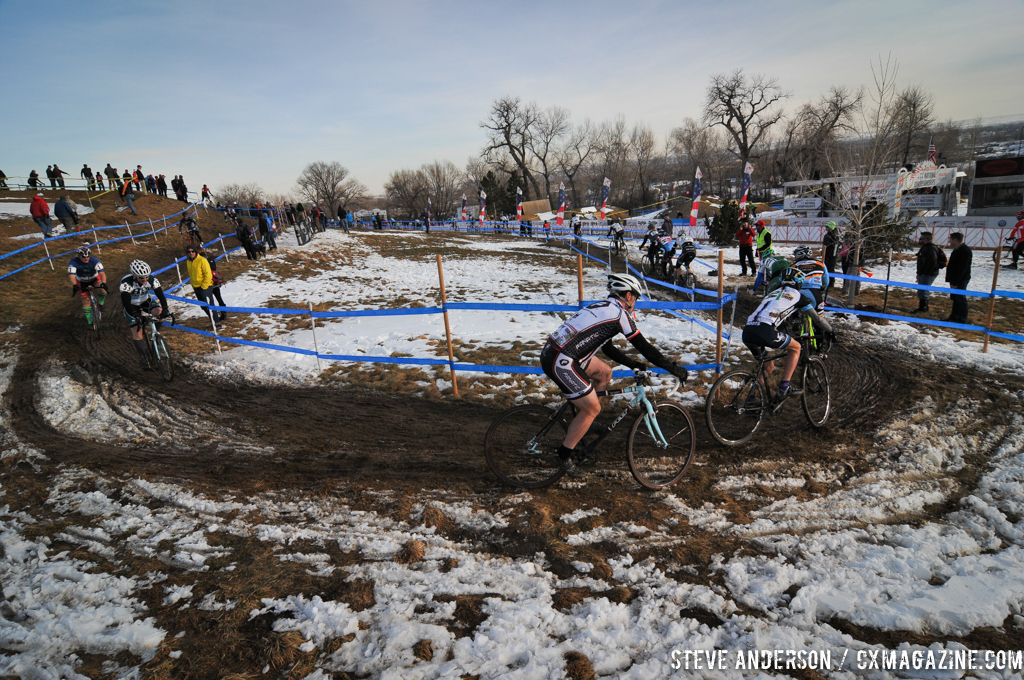 Racers round the muddy course. © Steve Anderson