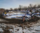 Racers round the muddy course. © Steve Anderson