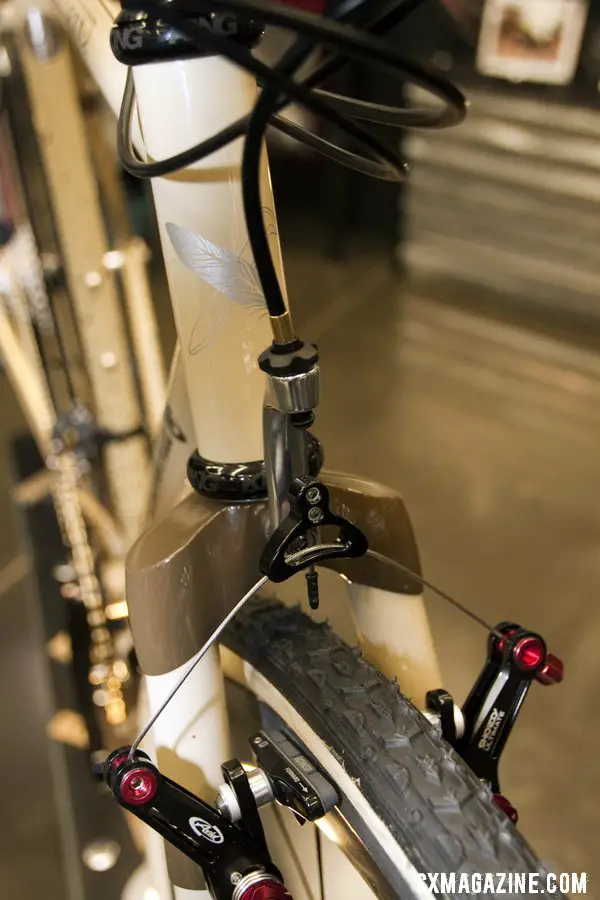Six Eleven Bicycle Co.\'s added a fork-mounted cable hanger to the Wound Up carbon cross fork.  NAHBS 2012. ©Cyclocross Magazine