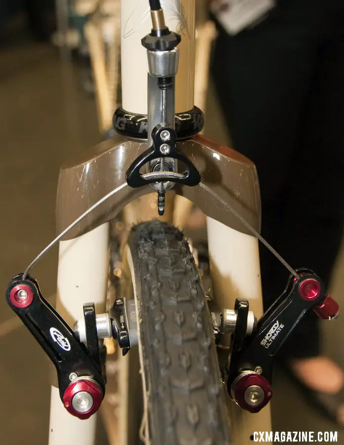 Six Eleven Bicycle Co.\'s added a fork-mounted cable hanger to the Wound Up carbon cross fork.  NAHBS 2012. ©Cyclocross Magazine