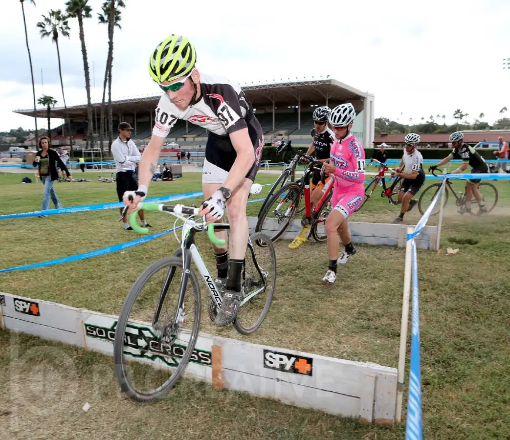 The Fairplex in Pomona, California, has never seen anything like this. Aaron Schooler (Norco/SRI Importing) bunnies the barriers as Tobin Ortenblad (Cal Giant), Mike Sherer (Optum), Cory Greenberg (VRC Get Crackin-MS Society) and Mark McConnell (Synergy) go for a run. © Phil Beckman/PB Creative/pbcreative.smugmug.com