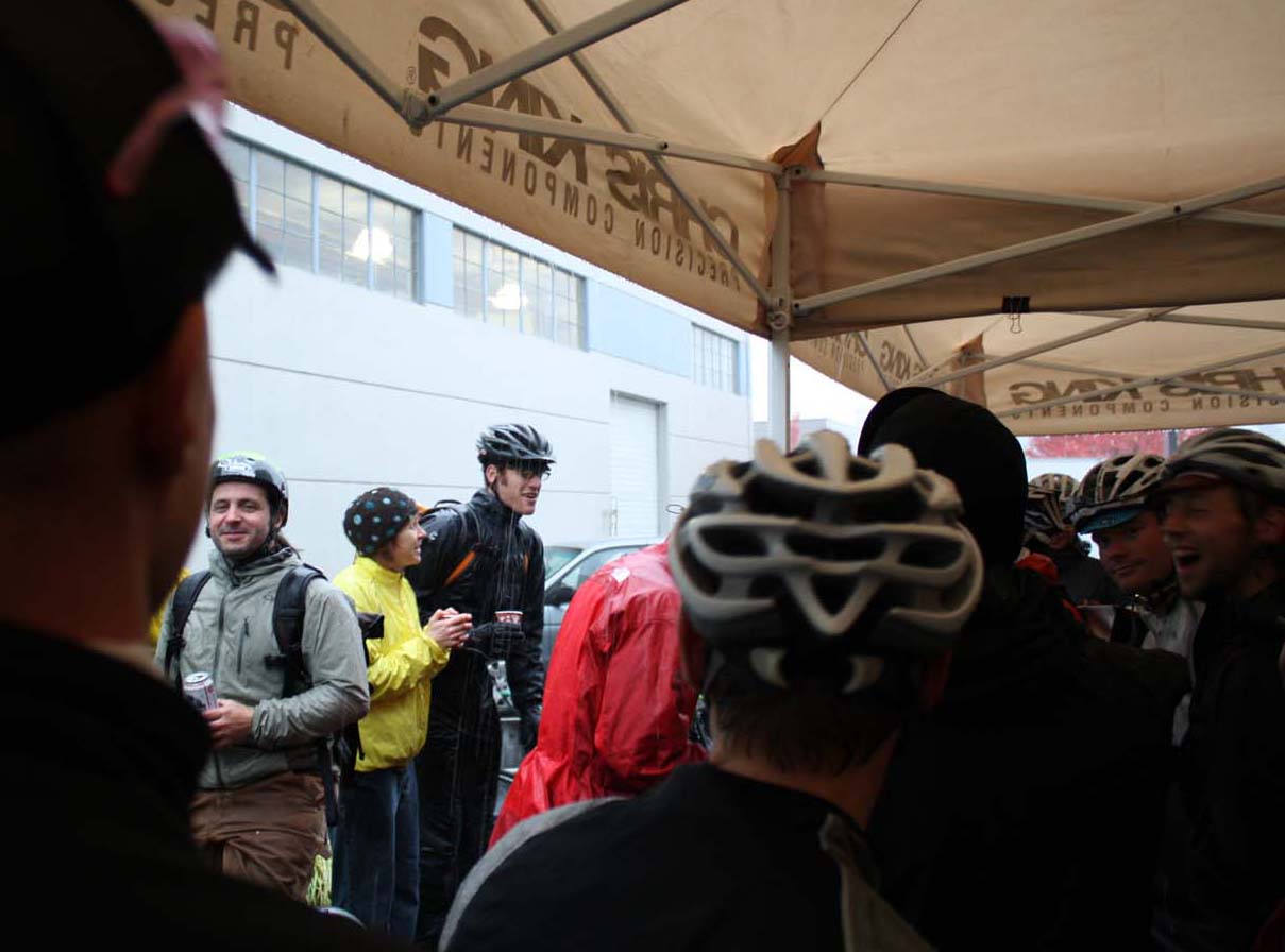 Only Seattle racers stand outside the tent. 