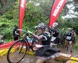 Sacramento's Team Beer's French Maids test the water of the cespool. SSCXWC 2011 © Cyclocross Magazine