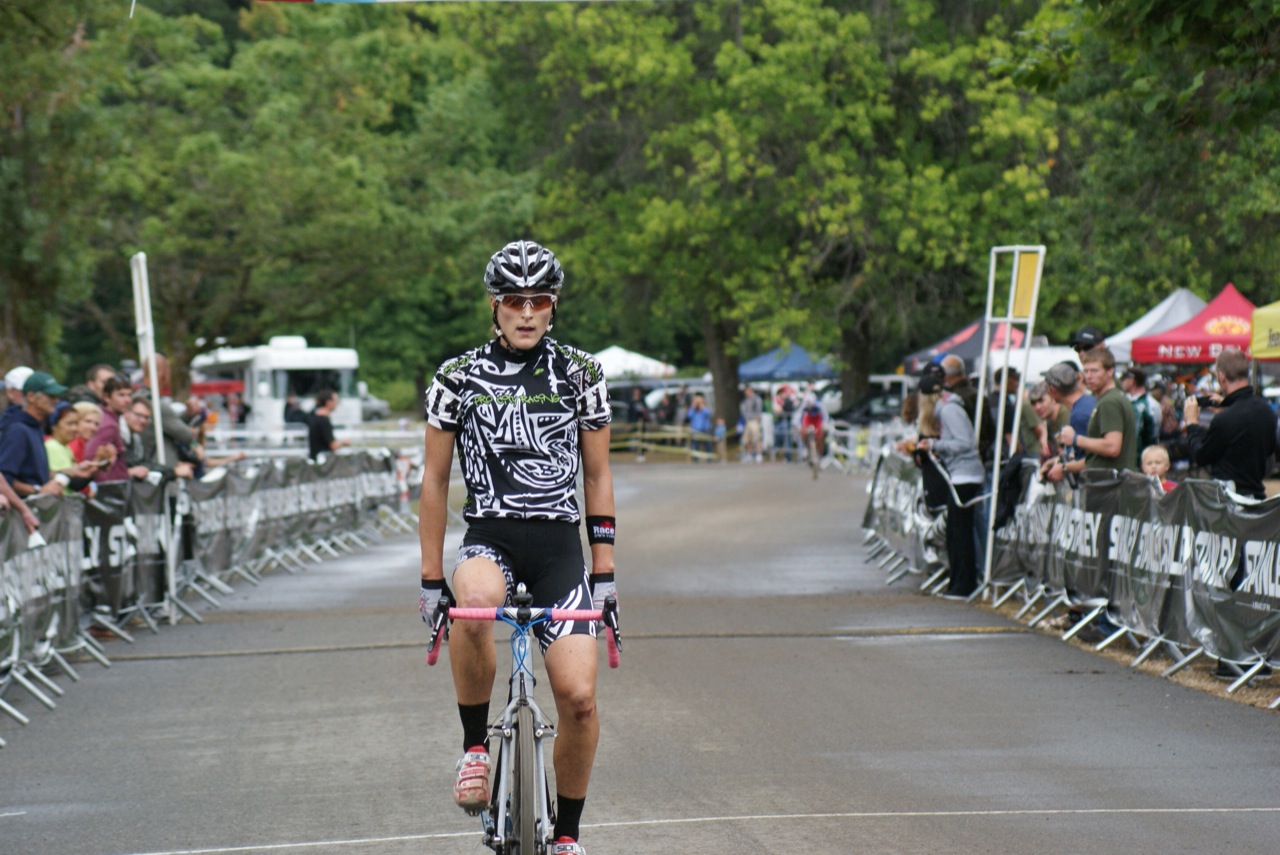 Mycal Dyck rolls thru the finish with Caroline Mani in the distance. © Kenton Berg 