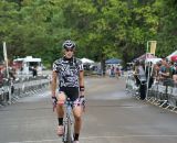 Mycal Dyck rolls thru the finish with Caroline Mani in the distance. © Kenton Berg 