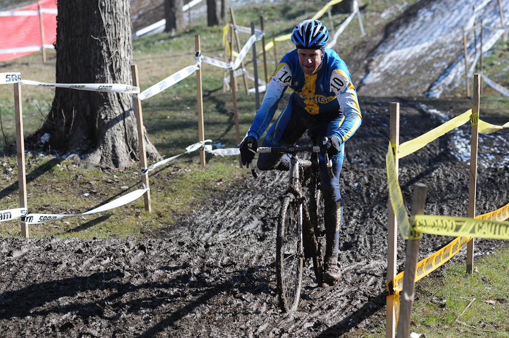 Benny Anderson of Sweden keeping it upright in the slick muddy conditions of the Mens 55-59 race. ©Steve Anderson