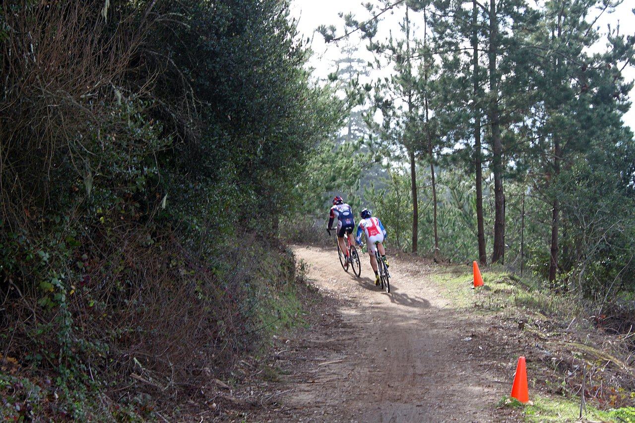 Johnson sits on Robinson's wheel on lap 1. Surf City Cyclocross Series Finale, Aptos High School, 1/10/10. ? Cyclocross Magazine