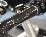 Katie Compton's new signature handlebar: Thomson's KFC One carbon bar, with dual cable housing slots on the underside of the bara. ©Cyclocross Magazine