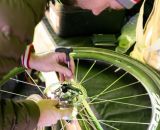 Cannondale-Cyclocrossworld.com Matt Roy tightens the disc rotors on Johnson's Zipp 303s ©Whit Bazemore