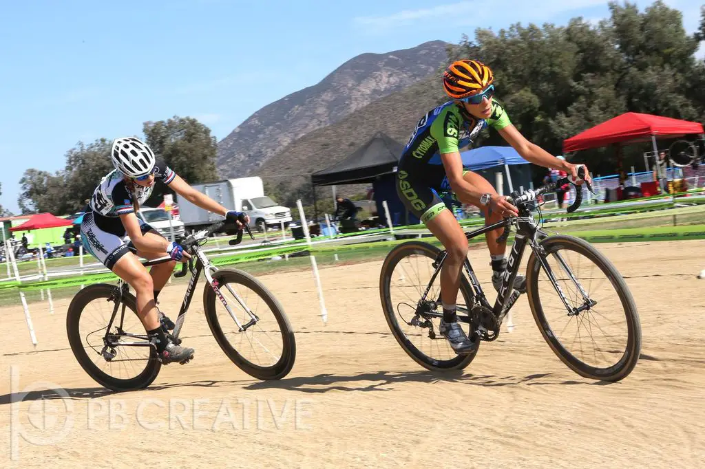 Carolin Shiff (SDG) rounds the ballfield basepath with Alexis Ryan (TEAM SoCalCross) in tow early in Women’s A. © Phil Beckman/PB Creative (pbcreative.smugmug.com)