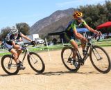 Carolin Shiff (SDG) rounds the ballfield basepath with Alexis Ryan (TEAM SoCalCross) in tow early in Women’s A. © Phil Beckman/PB Creative (pbcreative.smugmug.com)