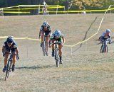 Laura Van Gilder powers away from Katie Antonneau and Ashley James in the sprint for second, while Sue Butler dismounts with a jammed drivetrain © 2010 Jeffrey B. Jakucyk