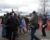 A crew presents a beaming Nash with a birthday cake. © Cyclocross Magazine